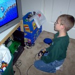 kid playing video game